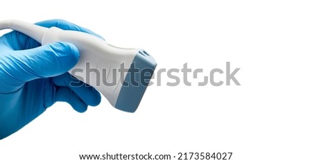 Medical ultrasound probe from ultrasonic machine in doctor's hand close-up, isolated on white. Ultrasound procedures Royalty-Free Stock Photo #2173584027