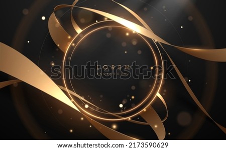 Golden light rings with ribbons on black background Royalty-Free Stock Photo #2173590629
