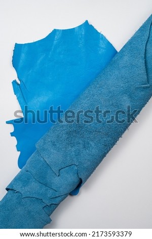 Blue roll of genuine leather. Wallpaper. Blue leather for shoes and bags