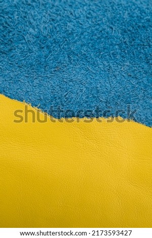 A roll of blue and yellow leather. Ukrainian leather production. Factory for sewing shoes in Ukraine