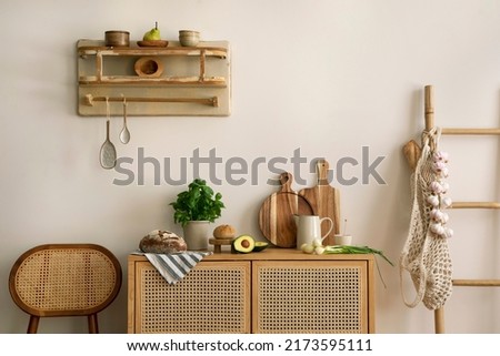 Interior design of kitchen space with rattan commode and chair,  ladder, herbs, vegetables, food and kitchen accessories in modern home decor.  Template. 