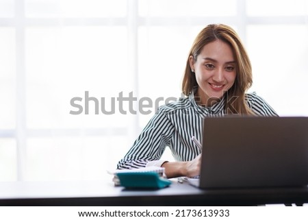 Modern Asian business woman in the home office, doing planning analyzing the financial report, business plan investment, finance analysis concept