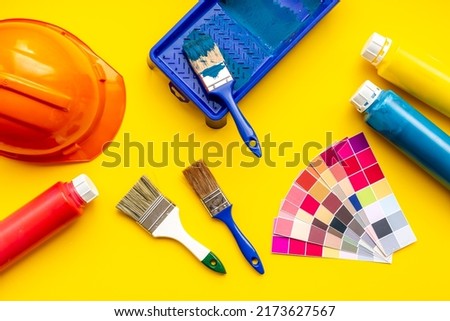 House renovation and painting tools with paintbrushes