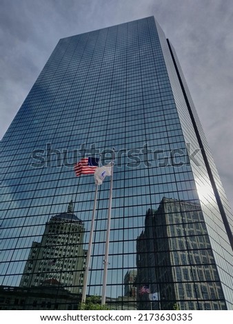 Business Building with the United States Flag.
Picture taken in Boston (MA). Best spot with sunset light and clouds.
Reflection from other buildings from the business district.