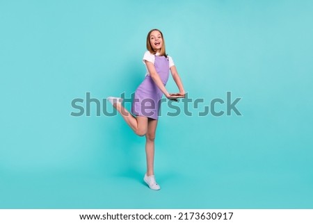 Full body photo of cheerful positive girl have good mood toothy smile isolated on teal color background