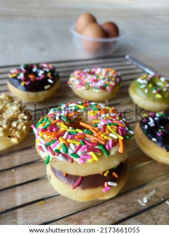 Donuts are fried snacks, made from a mixture of flour, sugar, egg yolks, yeast, and butter.