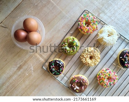 Donuts are fried snacks, made from a mixture of flour, sugar, egg yolks, yeast, and butter.