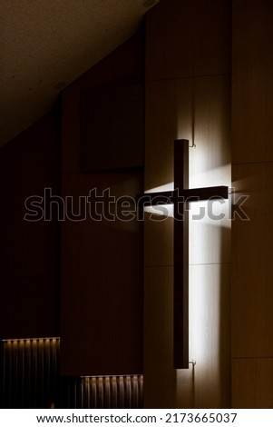 a church cross with light and shadow Religion in the Holy Space. The faith cross gives the heart of faith. High-resolution photo copy space