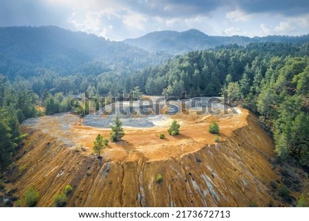 Restoration of abandoned mine site. Pine trees growing over copper and gold mine tailings in Paphos forest, Cyprus Royalty-Free Stock Photo #2173672713