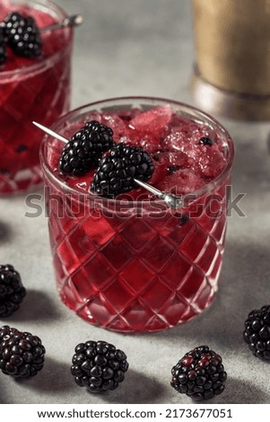 Boozy Refreshing Bramble Blackberry Cocktail with Vodka and Lemon Royalty-Free Stock Photo #2173677051