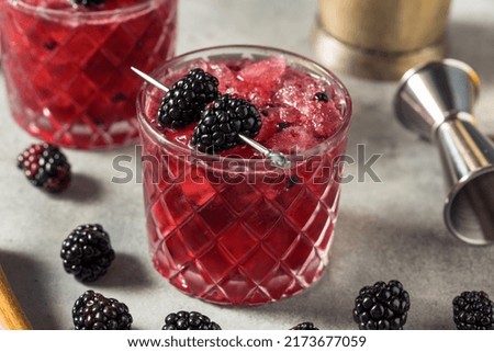 Boozy Refreshing Bramble Blackberry Cocktail with Vodka and Lemon Royalty-Free Stock Photo #2173677059