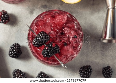 Boozy Refreshing Bramble Blackberry Cocktail with Vodka and Lemon Royalty-Free Stock Photo #2173677079