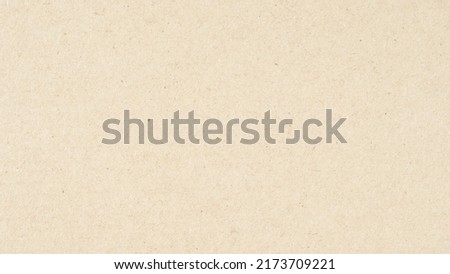 Abstract brown recycled paper texture background.
Old Kraft paper box craft pattern. top view.