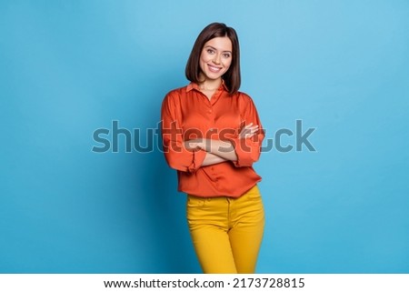 Photo of young pretty girl crossed hands smart boss marketer expert isolated over blue color background