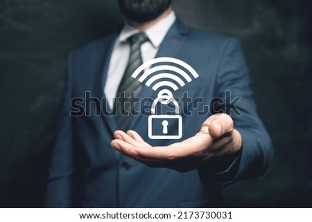Wifi icon and lock. WiFi protection. Man holding in his hand
