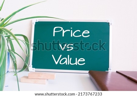 Text Price vs Value written on the green chalkboard