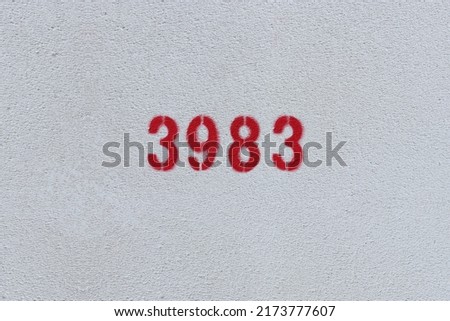 Red Number 3983 on the white wall. Spray paint.
