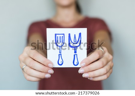 Picture icon in the hands of spatula and fork