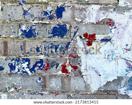 Urban colourful old chipped aged graffiti paint close up detail texture