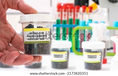 Petroleum Hydrocarbons Content Test. Petroleum Hydrocarbons Content Test content in soil sample in plastic container. Study of agricultural soil in a chemical laboratory Royalty-Free Stock Photo #2173820351