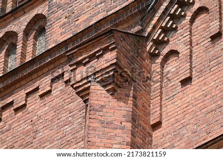 a fragment of complex historic red brickwork