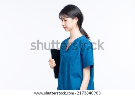Asian female nurse on white background