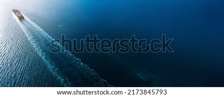 webinar banner, Aerial top view of cargo maritime ship with contrail in the ocean ship carrying container and running for export concept technology freight shipping by ship smart service  forwarder  Royalty-Free Stock Photo #2173845793