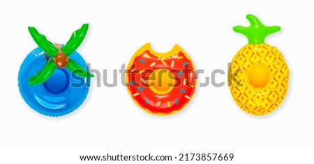 Top view studio isolated shot colorful coconut tree leaves, bitten glazed donut and pineapple round shape swimming pool lifesaver kid rubber ring use on sea beach travel vacation on white background.