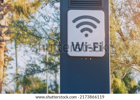 Wi-fi access point for wireless connection and digital communication in city park. Modern technology for lifestyle convenience Royalty-Free Stock Photo #2173866119
