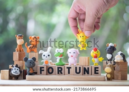 Man hand selected of Chinese Zodiac fortune. Concept of fortune.