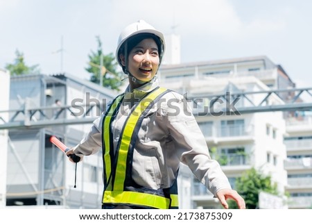 Japanese woman in work clothes Royalty-Free Stock Photo #2173875309