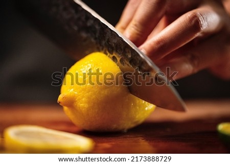 Sliced lemon, cool and fruity cold drink making process - stock photo