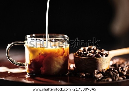Iced latte coffee, traditional handmade coffee making process - stock photo