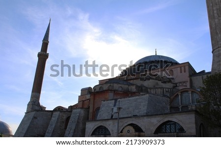 Photo of one of the structures in the ethnic historical and ottoman-patterned Topkapi Palace and Topkapi Palace mosque minarets on a sunny day in Turkey