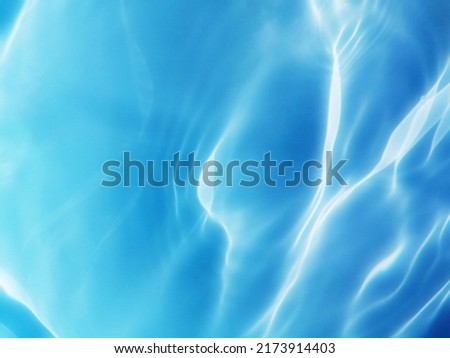 Blur​ abstract​ of​ surface​ blue​ water. Blue​ water.​ Water​ splashed​ use​ for​ graphic​ design. Water. Abstract​ of​ surface​ blue​ water​ reflected​ with​ sunlight​ for​ background. Blue​ sea.