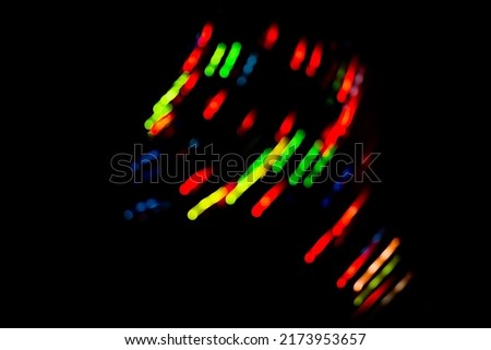 Neon colorful glow on a black backdrop. Iridescent neon background with light effect.