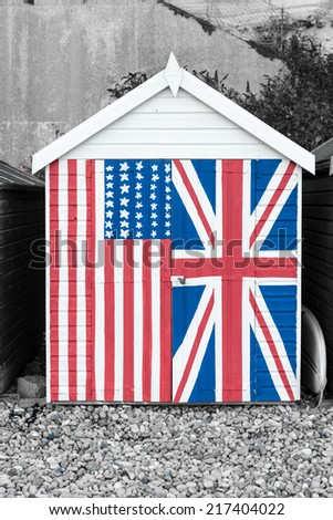 English beach hut with Union Jack and Stars and stripes painted on the front