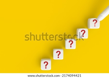 Questions Mark word in cube block on yellow background. FAQ Answer, QA. Copy space. 3D rendering