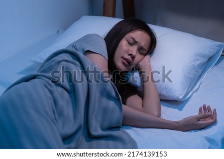 Sweet dream. Asleep, sleep asian young woman, girl under blanket, suffering from insomnia, awake at night in bedroom, tired and exhausted. Frustrated people with problem, exhausted on nightmares. Royalty-Free Stock Photo #2174139153