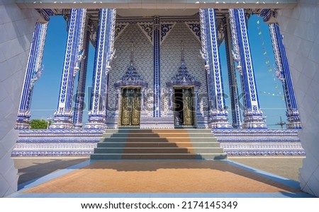 Entrance of blue ubosot at Wat Pak Nam Khaem Nu temple. It is in Takat Ngao, Tha Mai, Chanthaburi, Thailand. Royalty-Free Stock Photo #2174145349