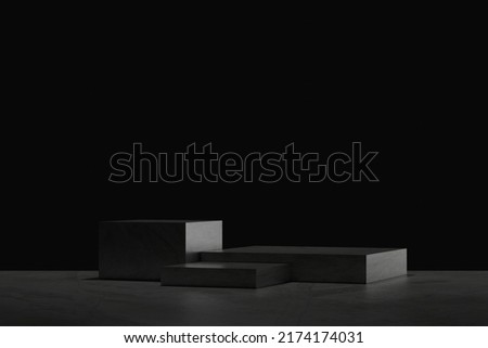 3D Black geometric stage podium. Dark background. Royalty-Free Stock Photo #2174174031