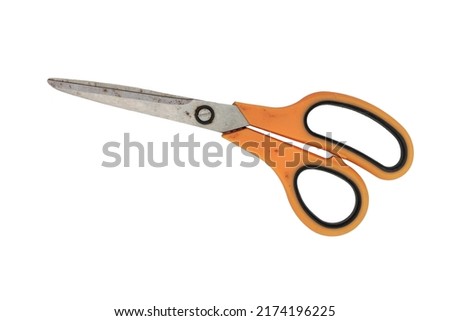 scissors with orange handles. old scissors isolated on white background.