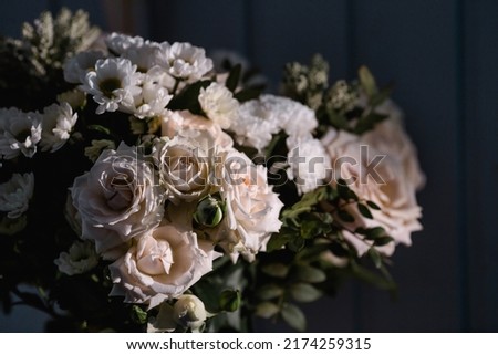 A beautiful bouquet of beige, cream roses and white chrysanthemums. Background floral image of pastel colors. Natural, environmentally friendly natural background. A copy of the place for the text.