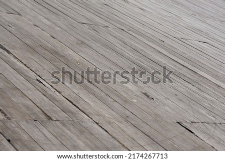The natural setting features iron wood planks arranged as the floor of a house or street with abstract patterns. This photo can be used for vintage, interior concept, design etc.                Royalty-Free Stock Photo #2174267713