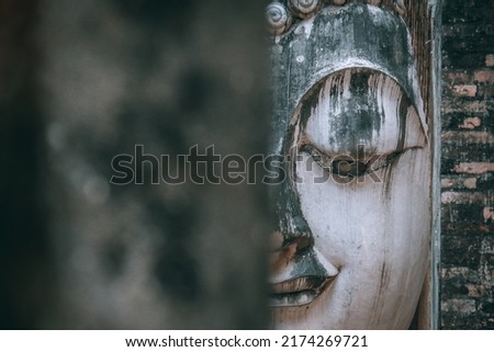 Old buddha statue inside the hall at Wat Sri Chum in Sukhothai, Thailand.