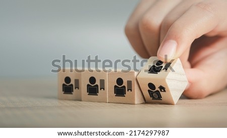 Hybrid workplace schedule, Gig economy, Freelance, Online business network communication, teamwork, home office concept. Hand flip wooden cube icon of gig economy, copy space for background or text. Royalty-Free Stock Photo #2174297987
