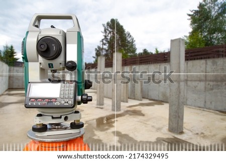 Device for surveyor. Optical theodelite on tripod. Electronic device for surveyor. Equipment for creating topographic maps. Theodelite in front of foundation. Art focus. Copy space about geodesy. Royalty-Free Stock Photo #2174329495