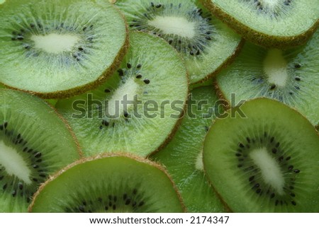 Overlapping juicy kiwi slices. Royalty-Free Stock Photo #2174347