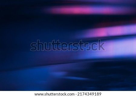 Blur light flare. Bokeh neon glow. Futuristic radiance. Defocused ultraviolet navy blue pink purple color flecks glare on dark modern abstract background. Royalty-Free Stock Photo #2174349189