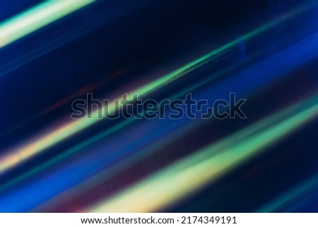 Defocused glow overlay. Neon light flare. Futuristic illumination. Blur LED navy blue green pink color lines glare dust scratches on abstract background.